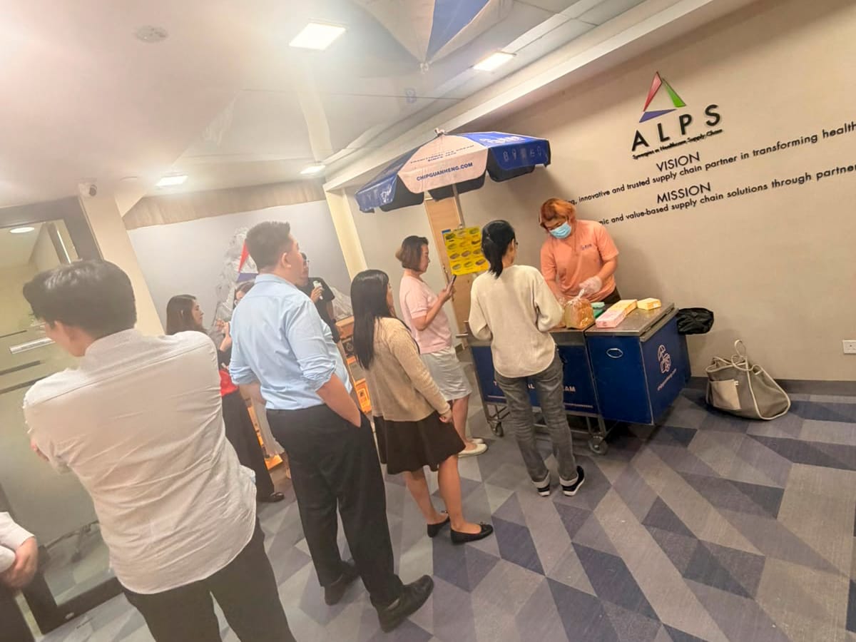 Image of ALPS staff members and their National Day ice-cream treat